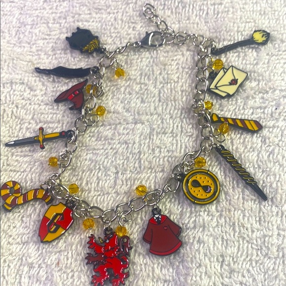 # 31 Charming Silver Bracelet with Red and Yellow Metal Charms - Picture 1 of 7